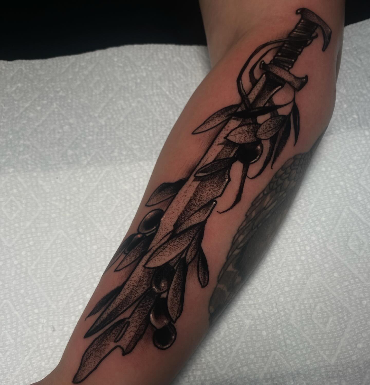 Sword and leaves dotwork tattoo on the forearm by ๐ฎ๐๐๐ฐ ๐๐ซ๐ค๐ข๐ฉ๐ฌ ๐๐๐ฆ๐๐ซ๐ฬ
