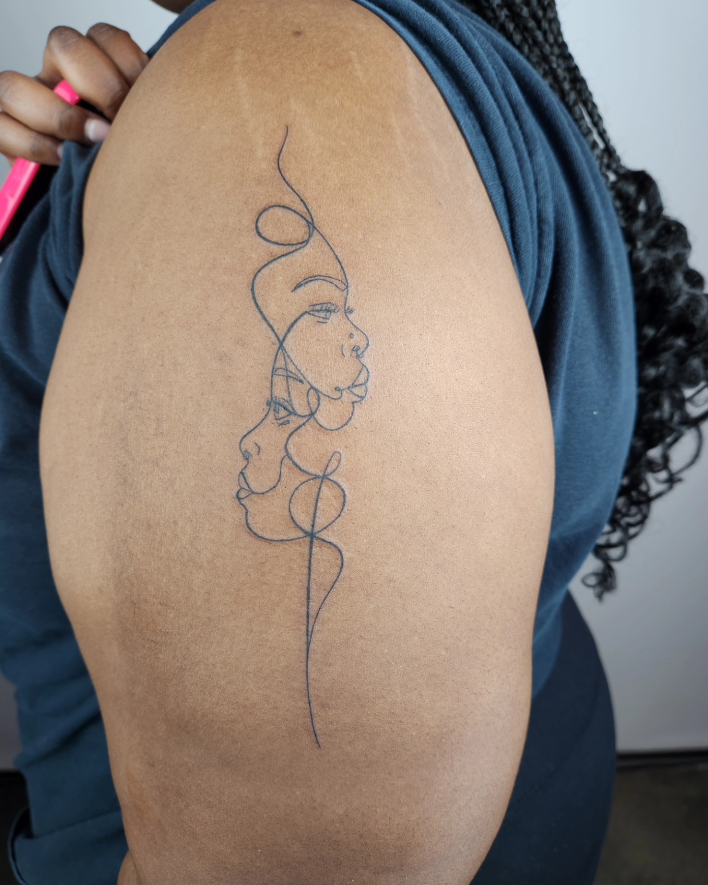 Abstract woman fine line tattoo on the shoulder by Amy Heath