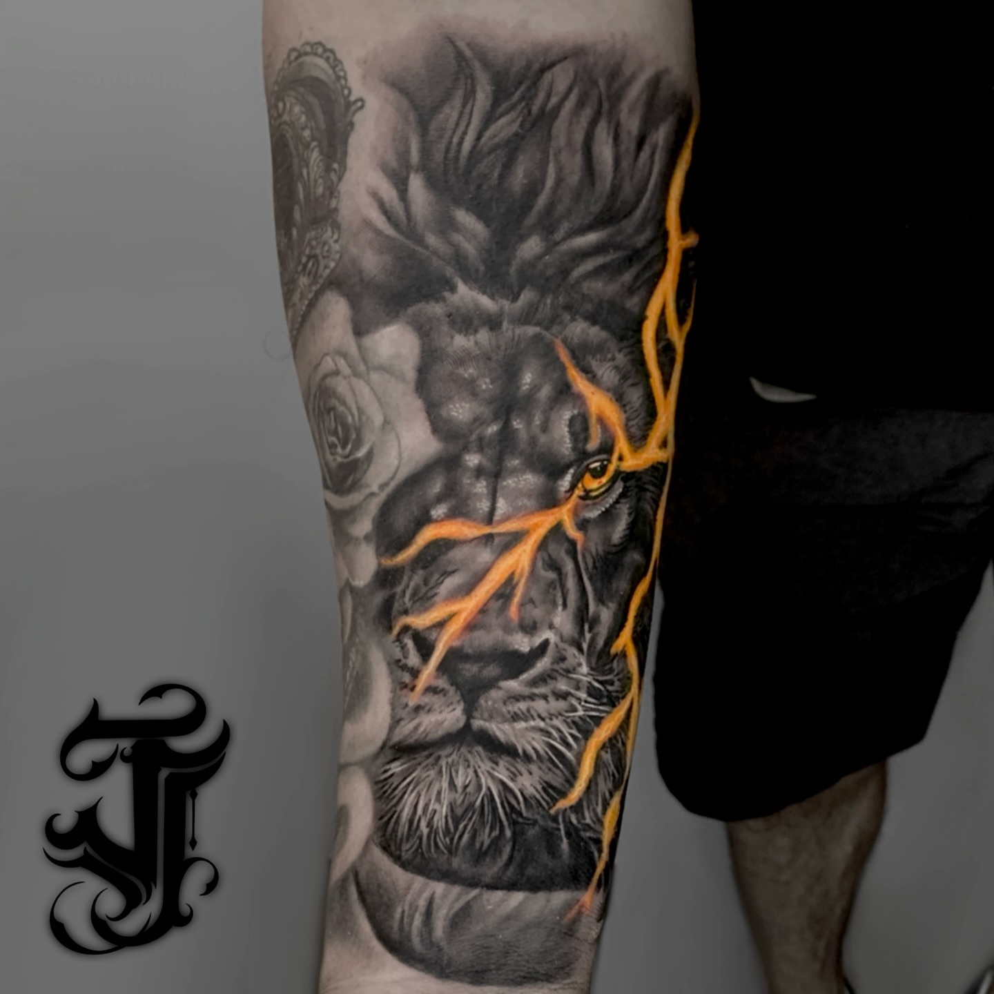 Lion realism tattoo on the forearm by Justin James