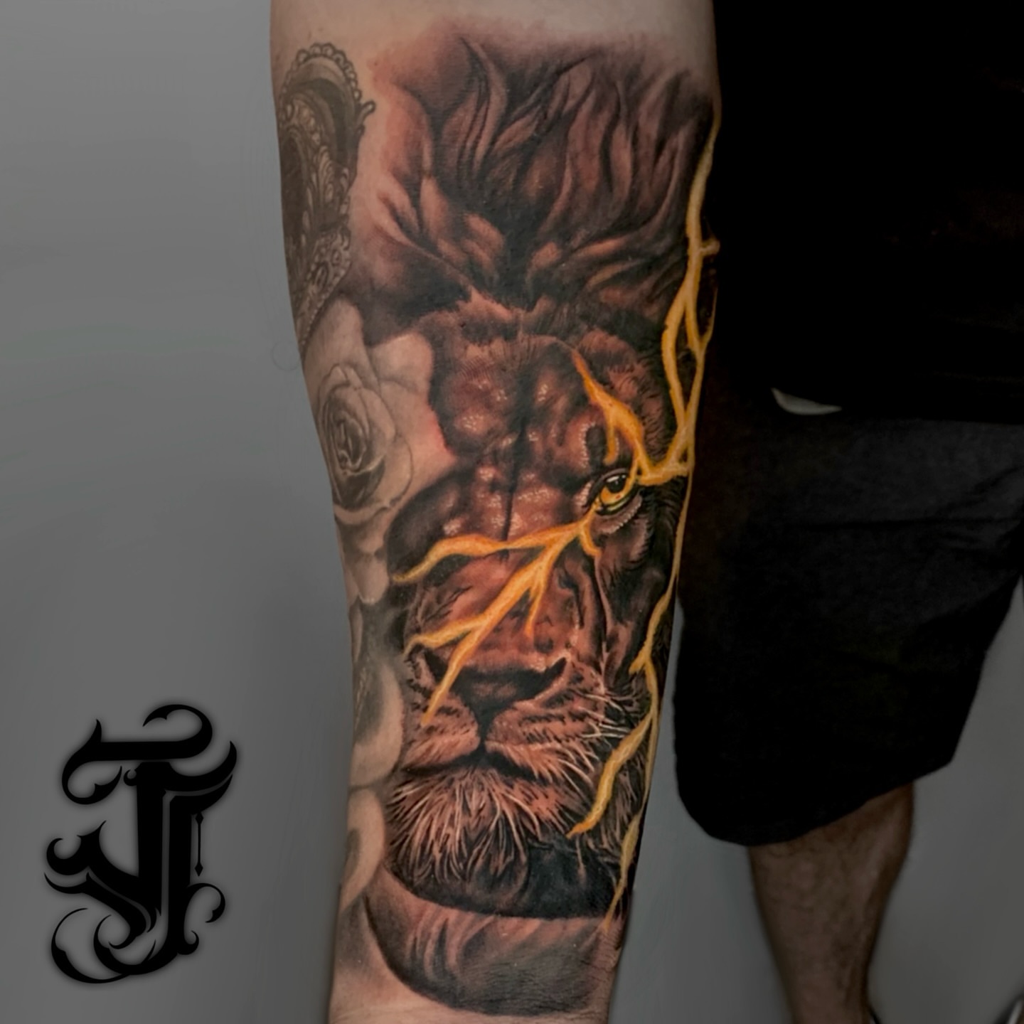 Lion realism tattoo on the forearm by Justin James