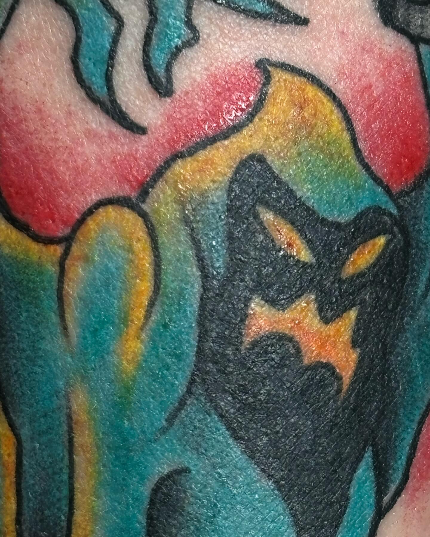 Cat American traditional tattoo on the upper arm by Ares Rhodes