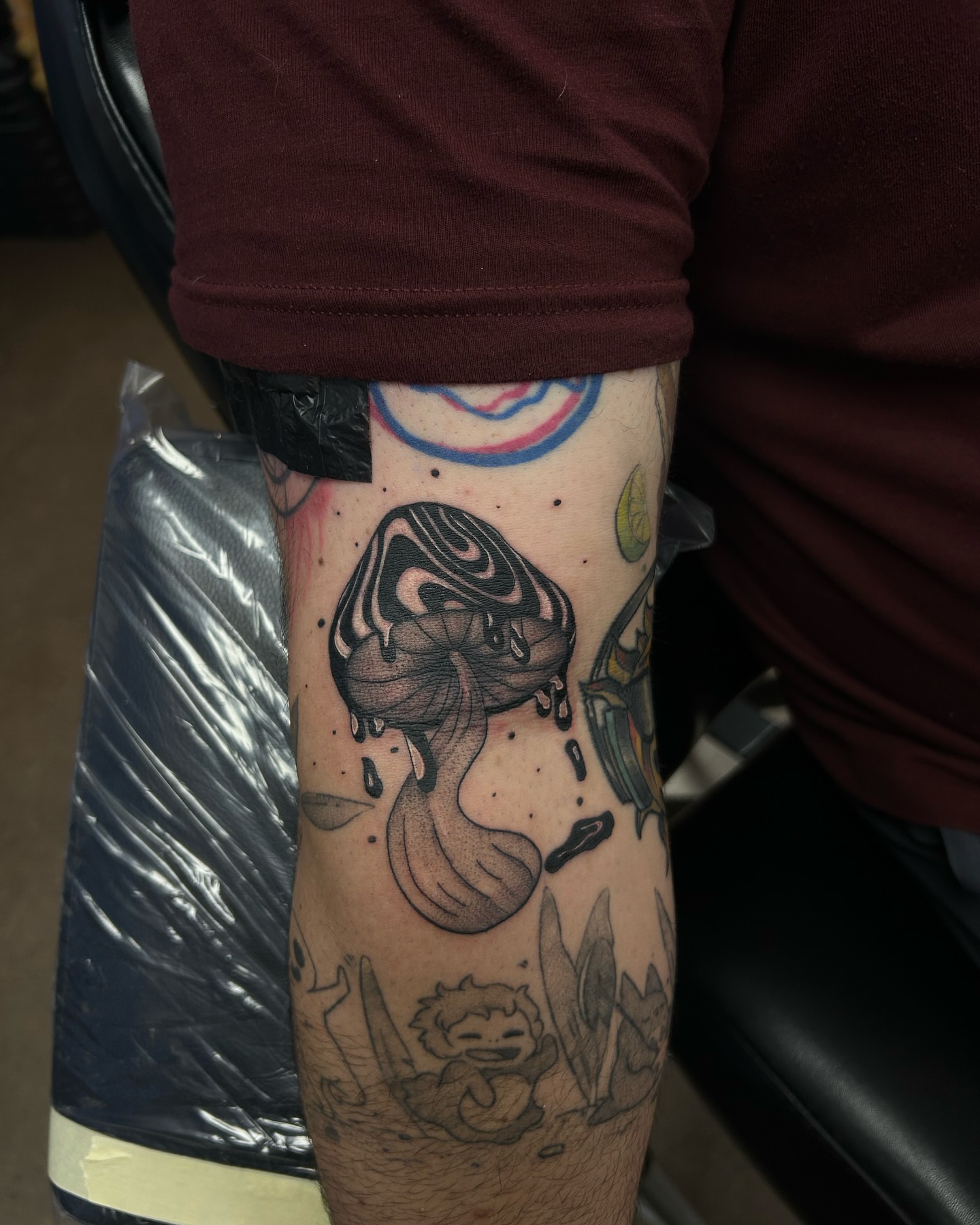Melting figure dotwork tattoo on the forearm by Anahi