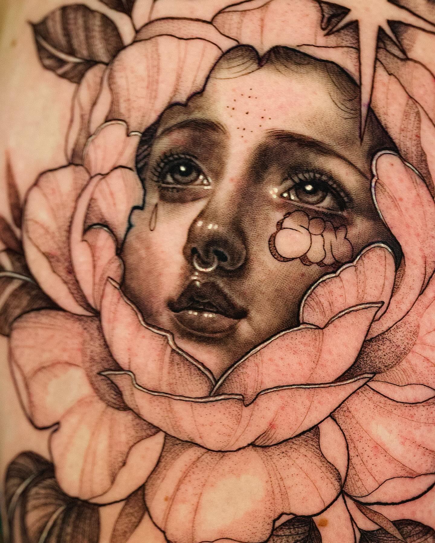 Flower and face realism tattoo on the forearm by Sabrina, Harrison, New Jersey