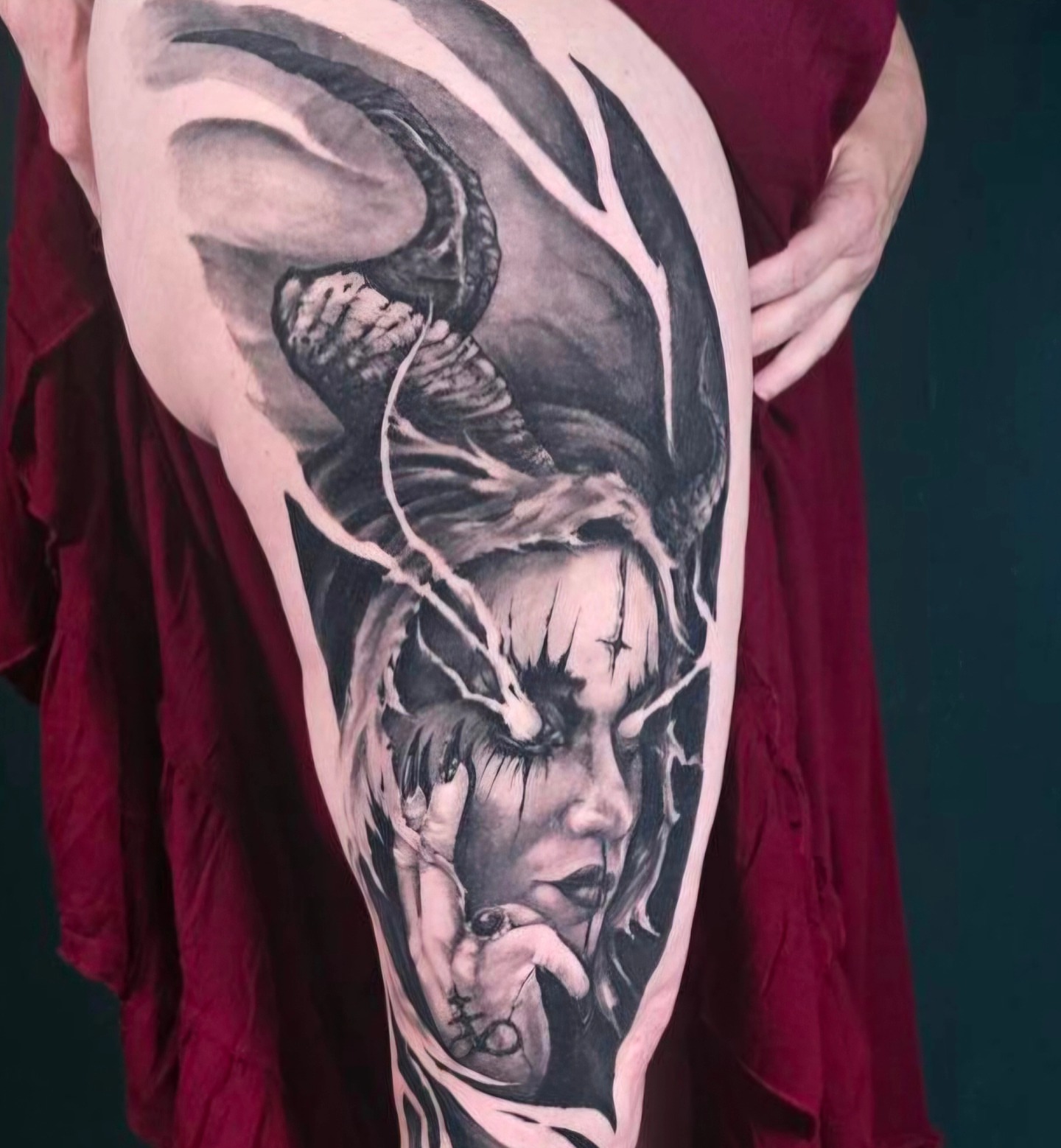 Woman with horns dark realism tattoo on the thigh by Chicagoland Tattoo artist - Dany Rojas