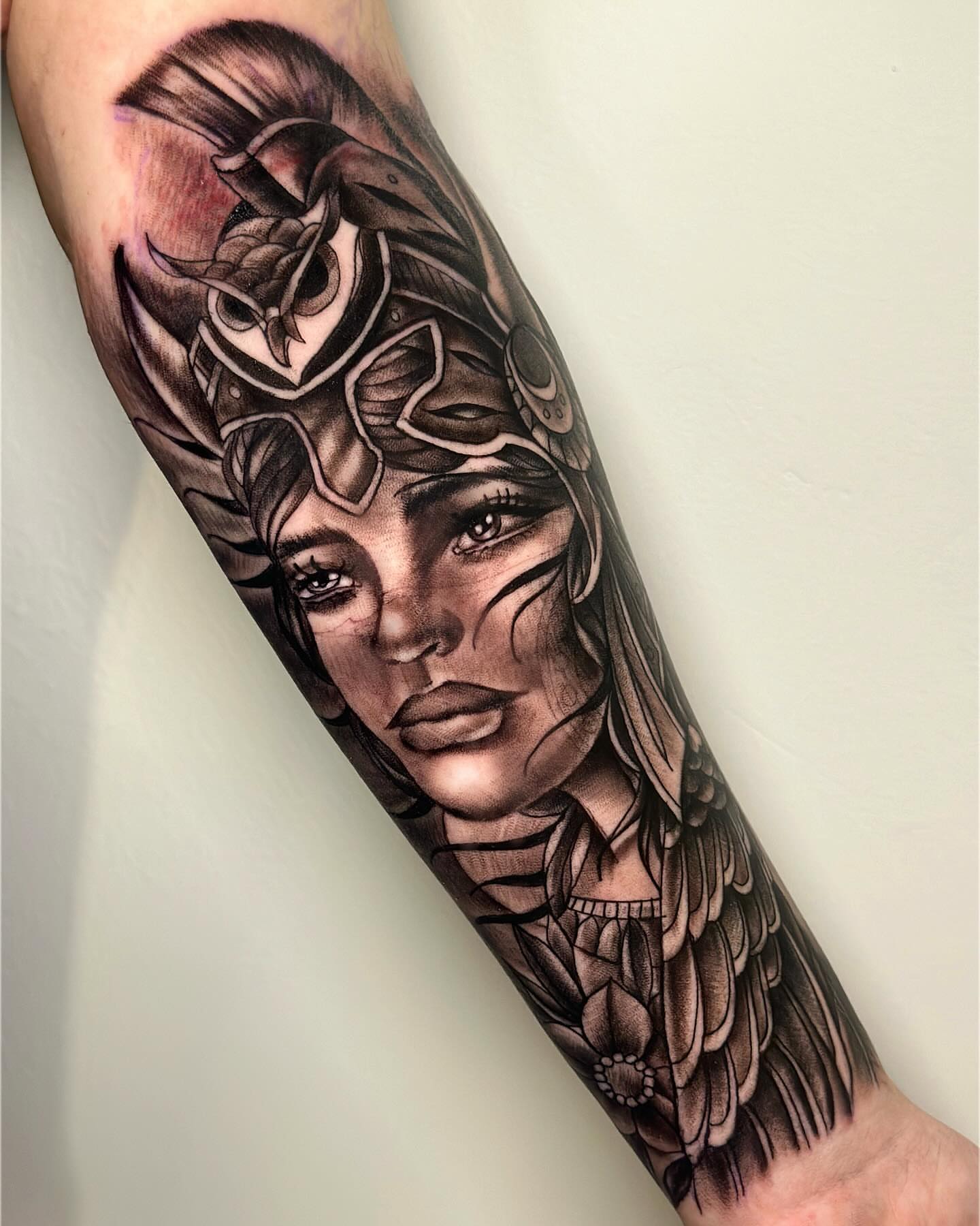 Woman with owl realism tattoo on the forearm by Anghel Patricia
