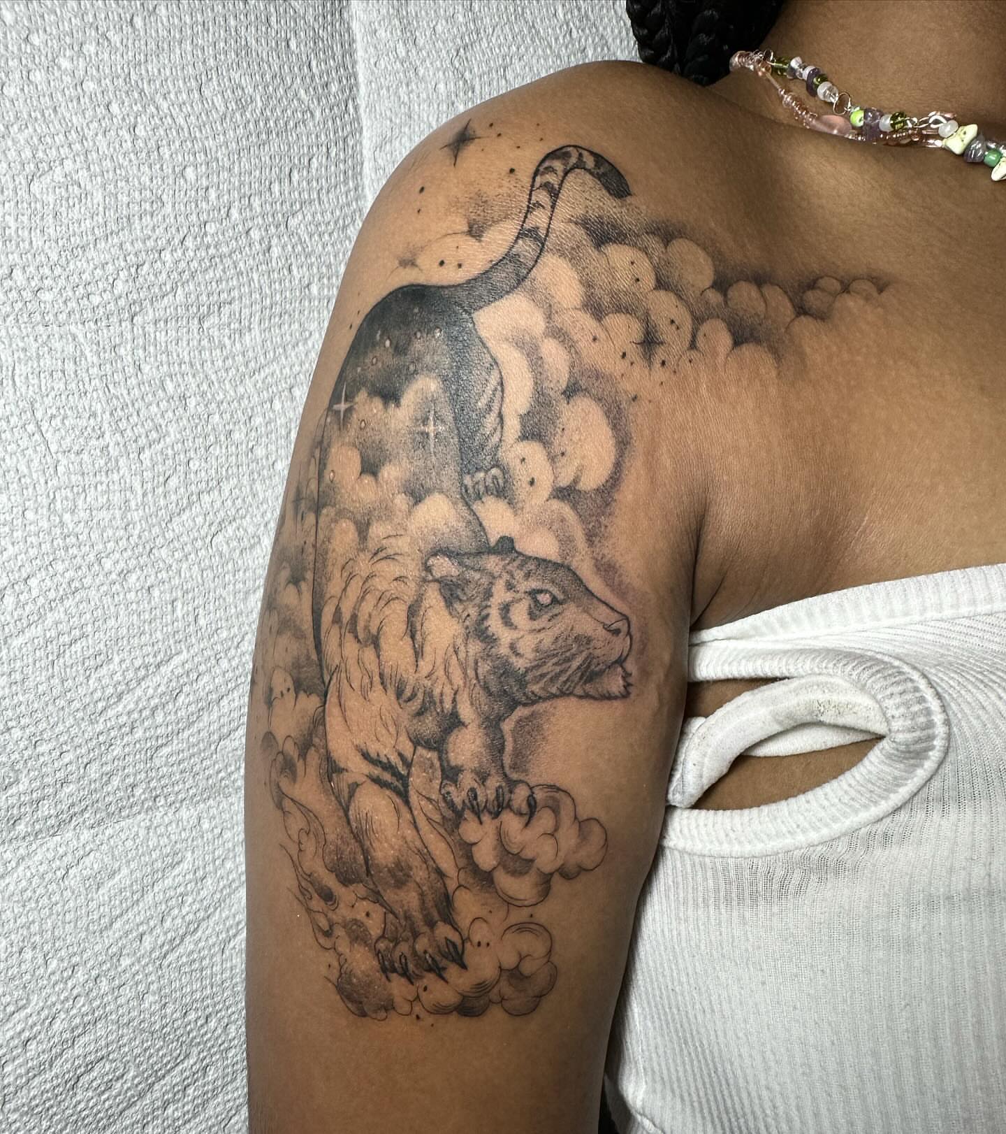 Panther and clouds dotwork tattoo on the shoulder by 𝔈𝔯𝔦𝔫 𝔊𝔦𝔩𝔩𝔦𝔩𝔞𝔫𝔡, Springfield, Ohio