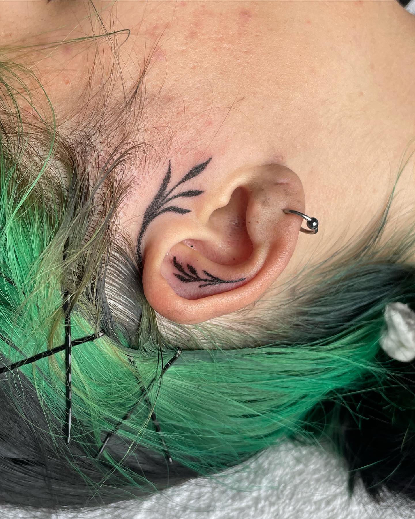 Leaf fine line tattoo on the head by ART