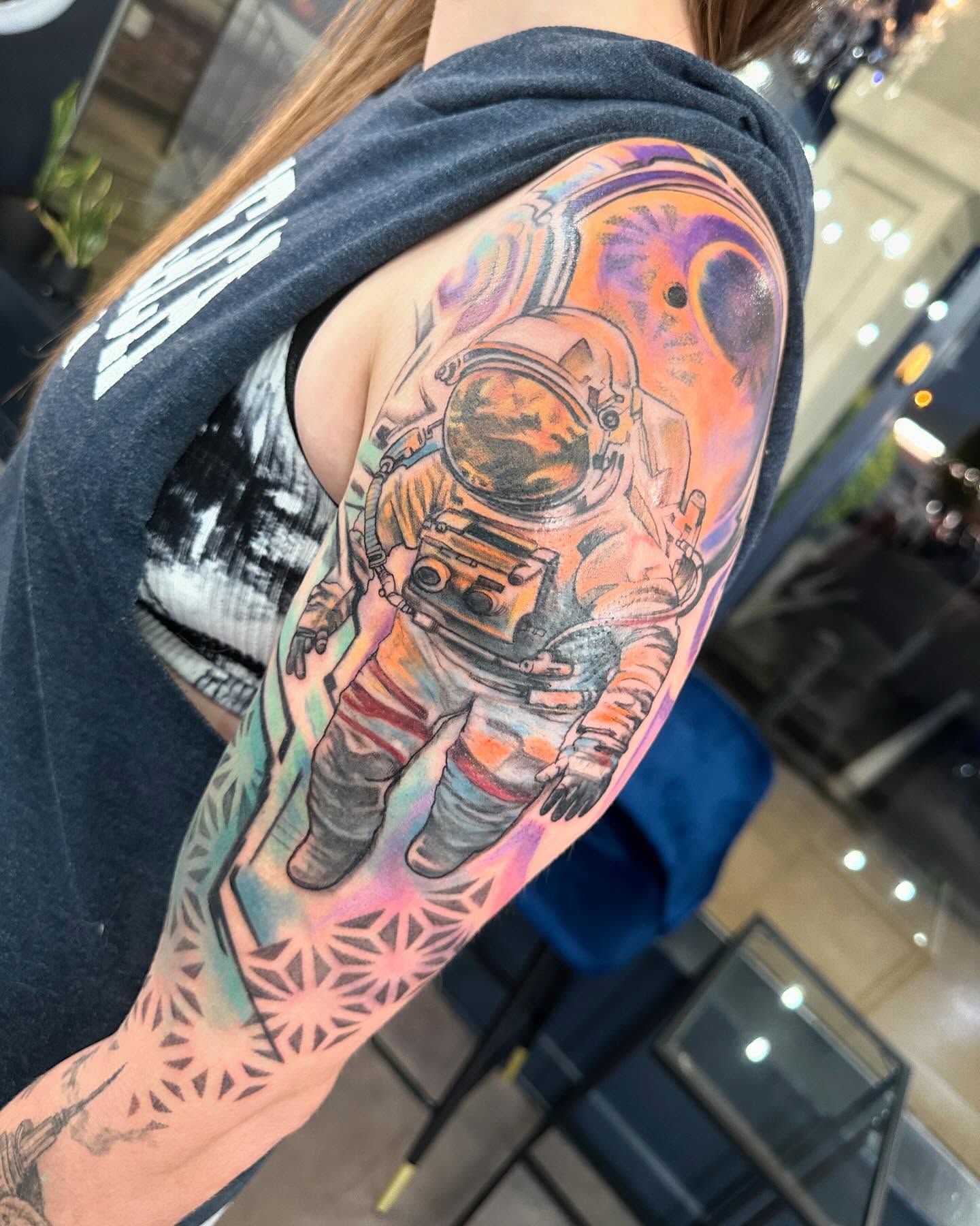 Astronaut realism tattoo on the upper arm by Cameron Hobbs, Woodbridge, Virginia