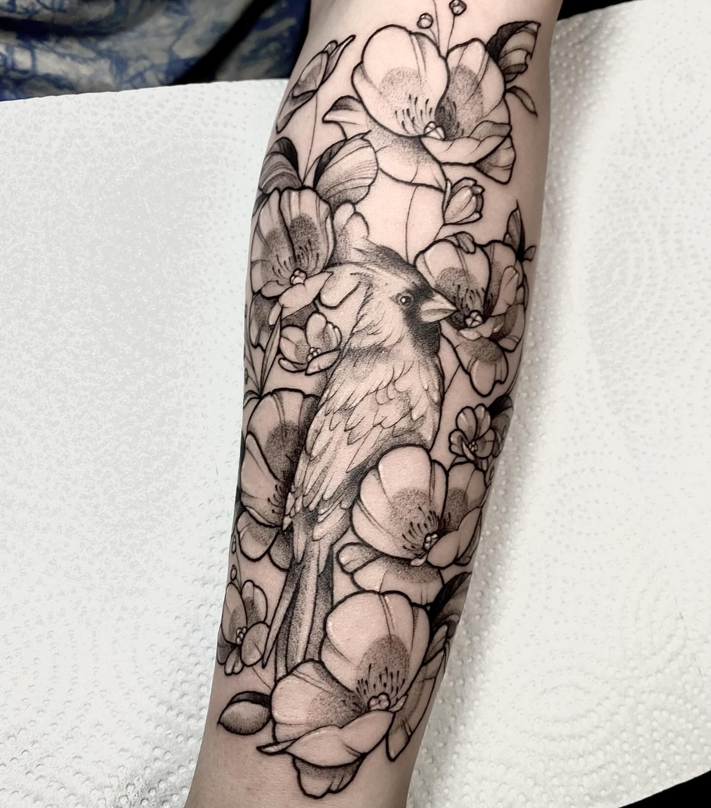 Bird and flowers realism tattoo on the forearm by 𝔈𝔯𝔦𝔫 𝔊𝔦𝔩𝔩𝔦𝔩𝔞𝔫𝔡, Springfield, Ohio