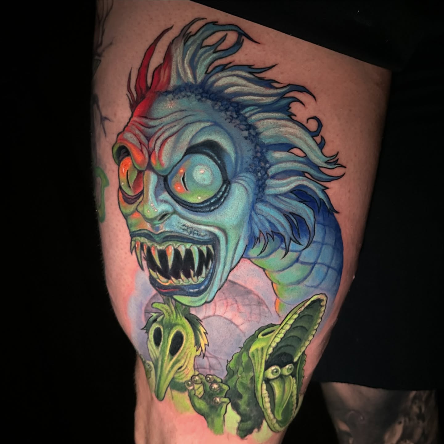 Monster dark realism tattoo on the thigh by shane baker
