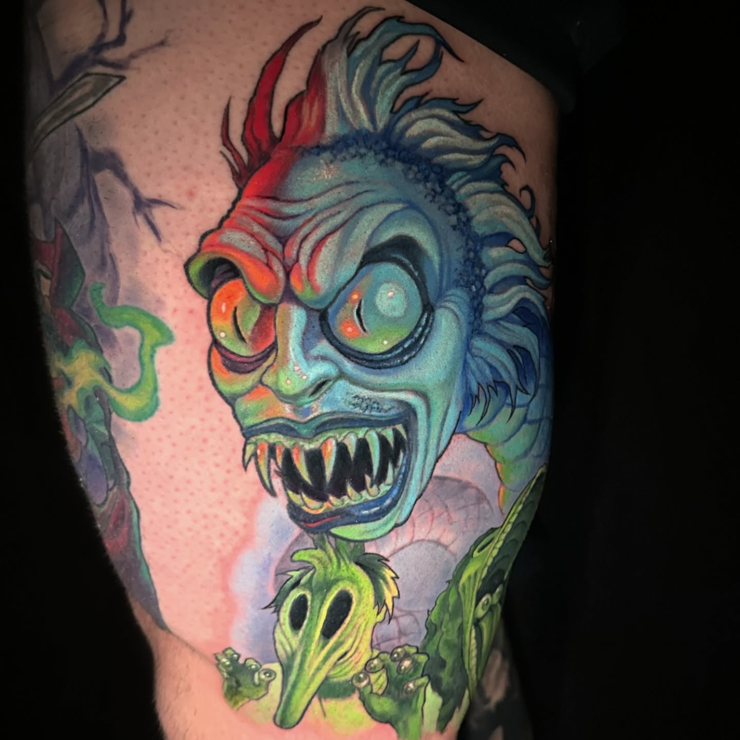 Monster head new school tattoo on the thigh by shane baker