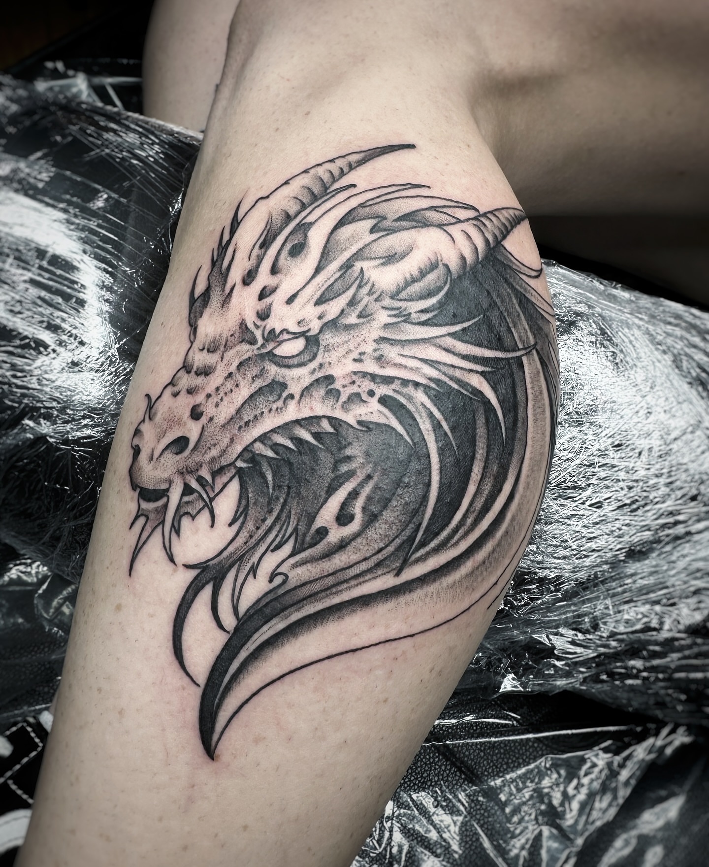 Dragon realism tattoo on the thigh by David Gray