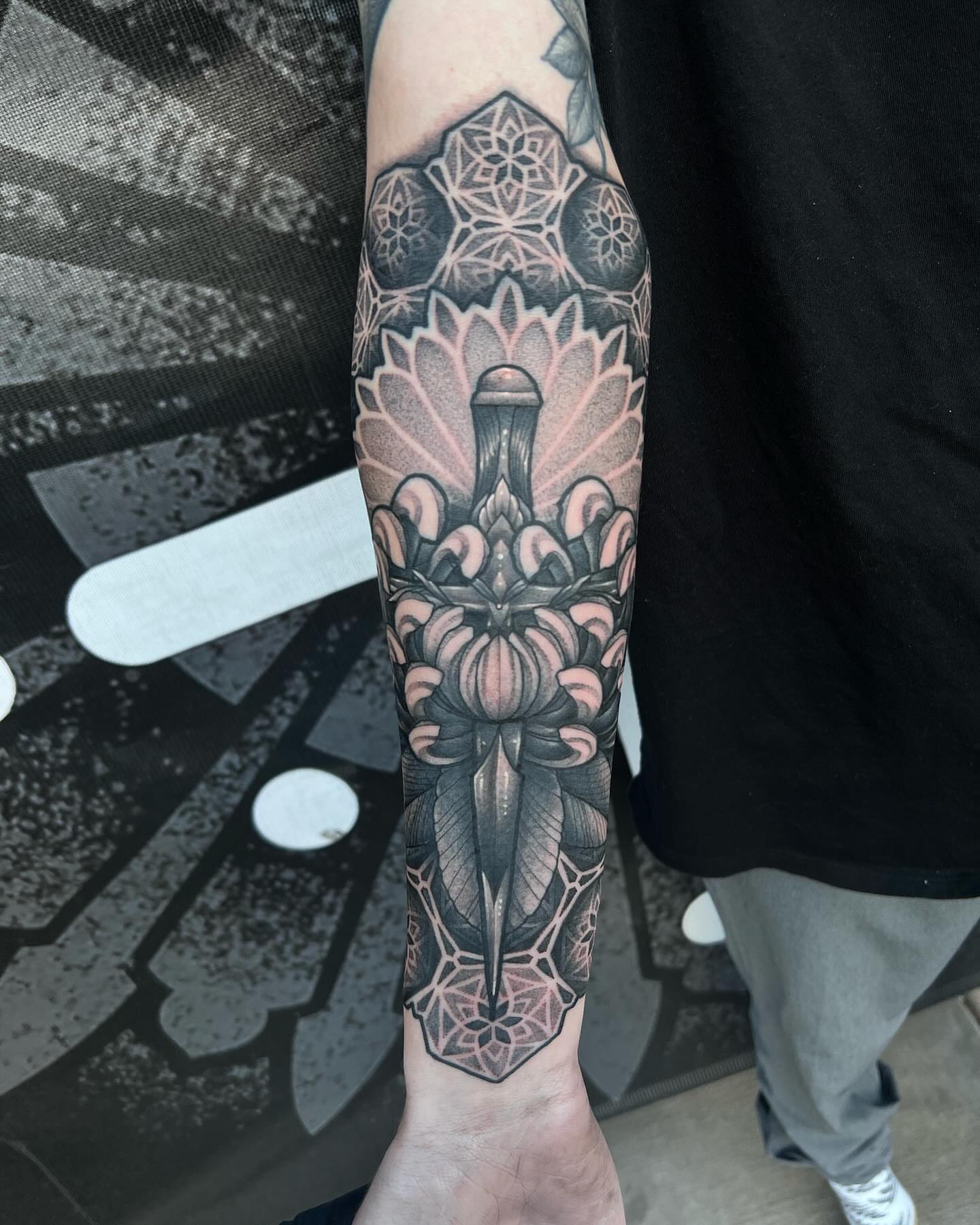 Lotus flower ornamental tattoo on the forearm by Jymi Calkins