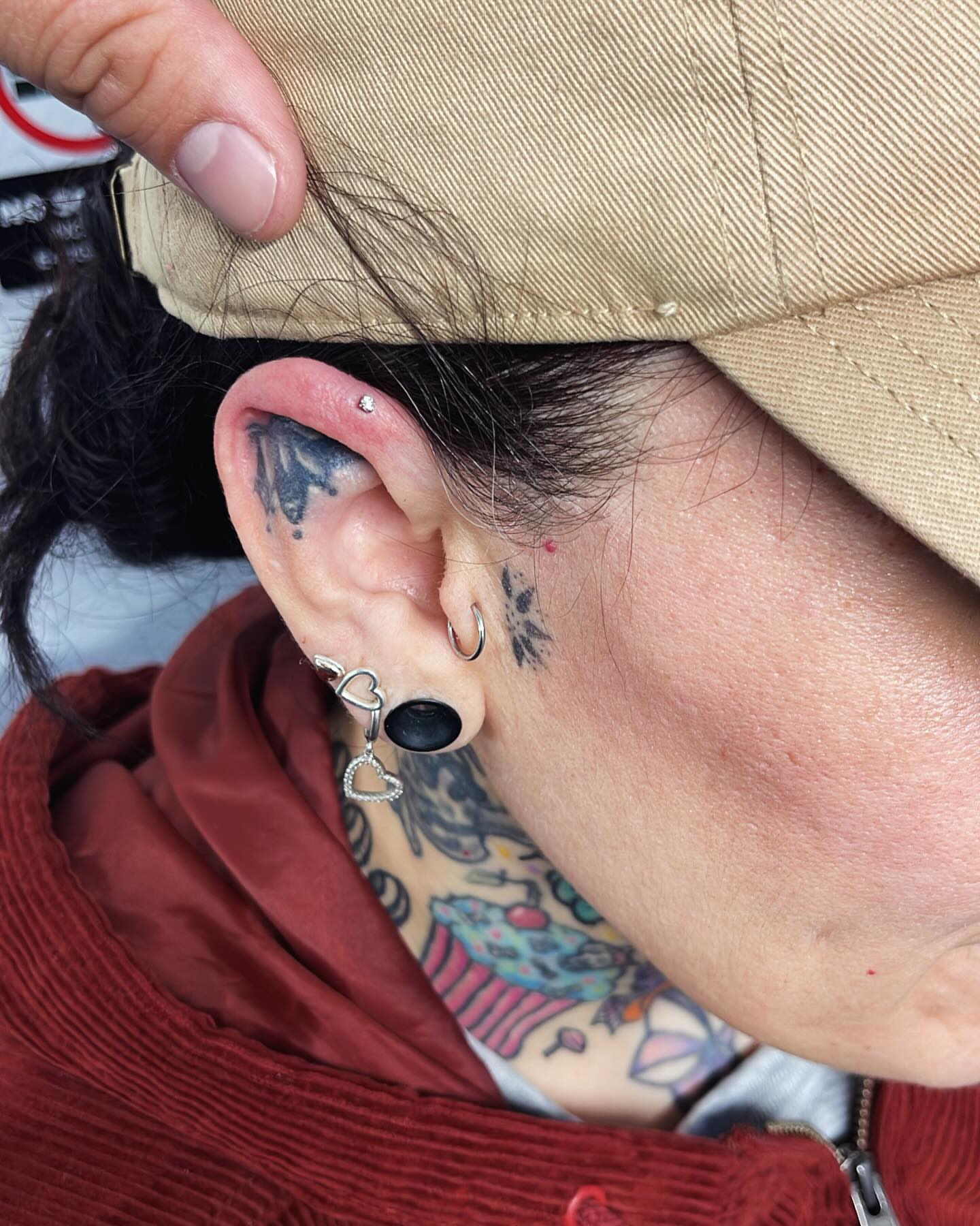 Ear piercing black and grey tattoo by Renzoe_piercingz