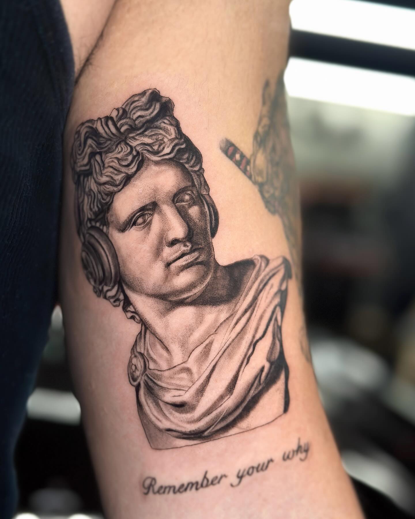 Statue bust realism tattoo on the forearm by Valery Cardona