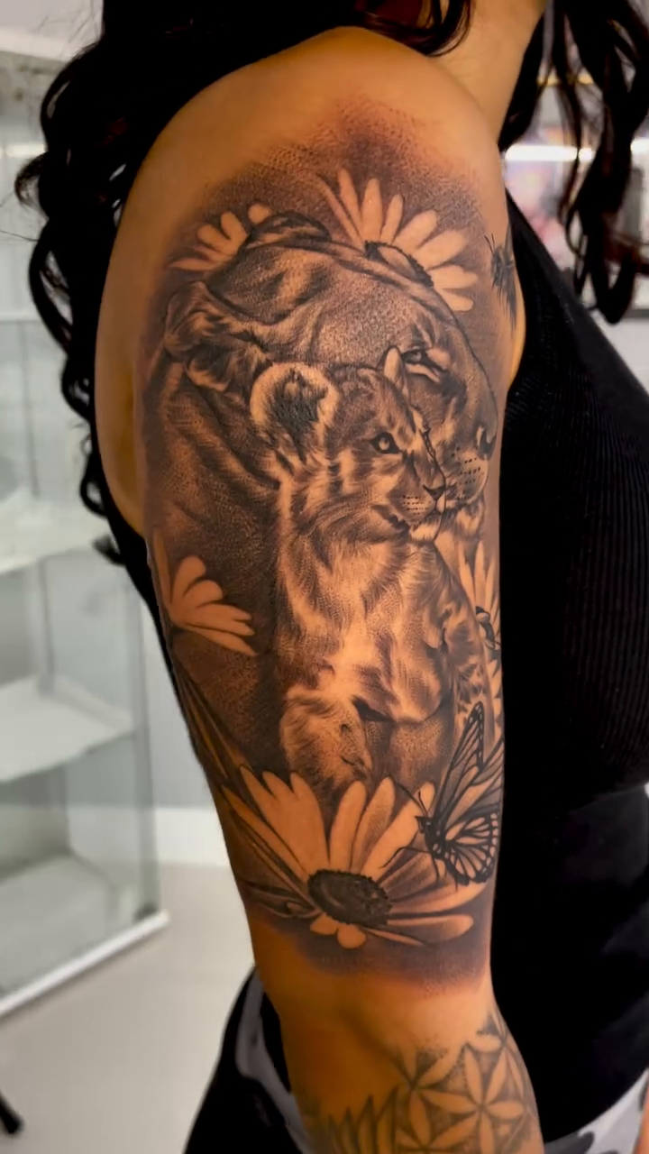 Tiger with flowers and bee realism tattoo by Carla V