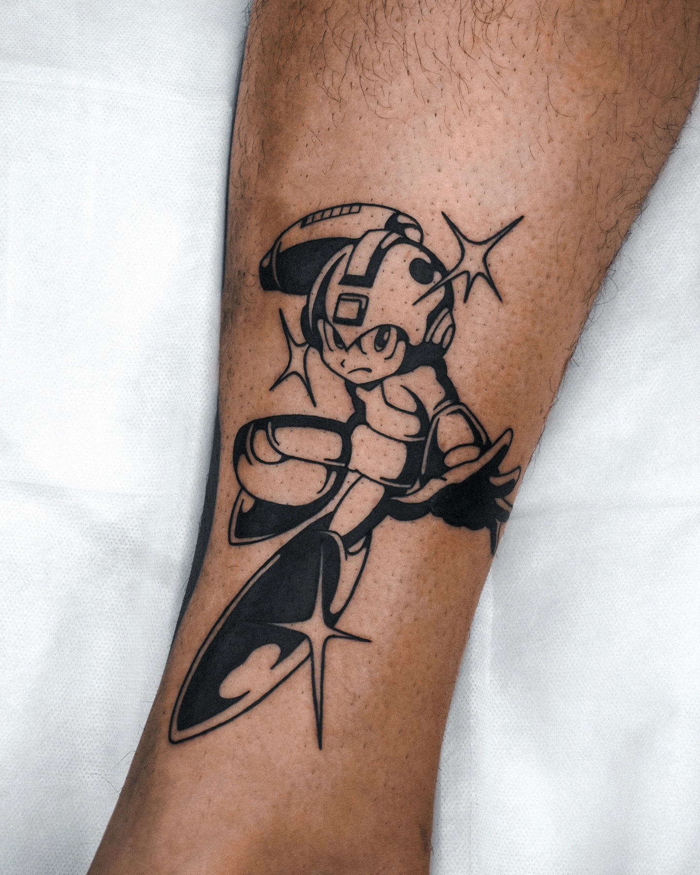 Megaman black and grey tattoo on the forearm by Jeremy "Jerms" Camposanto