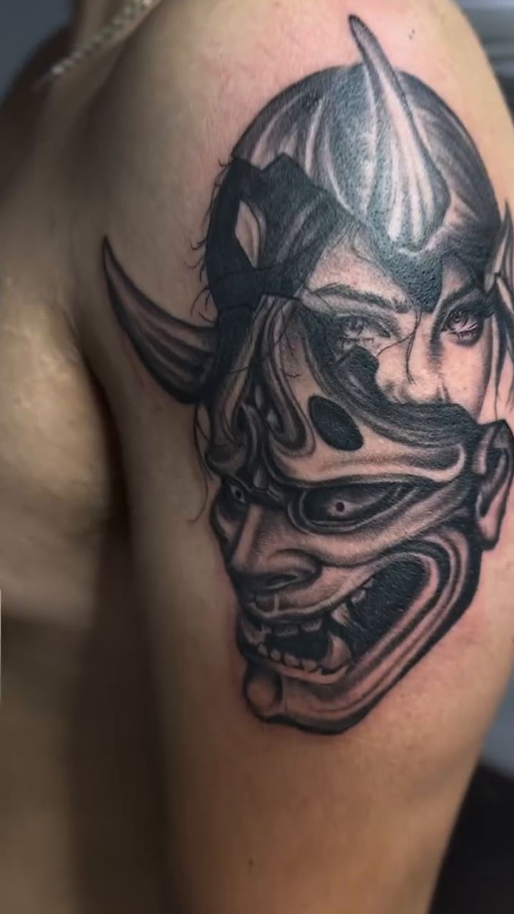 Hannya mask with female face realism tattoo on the shoulder by Antonio Gordon