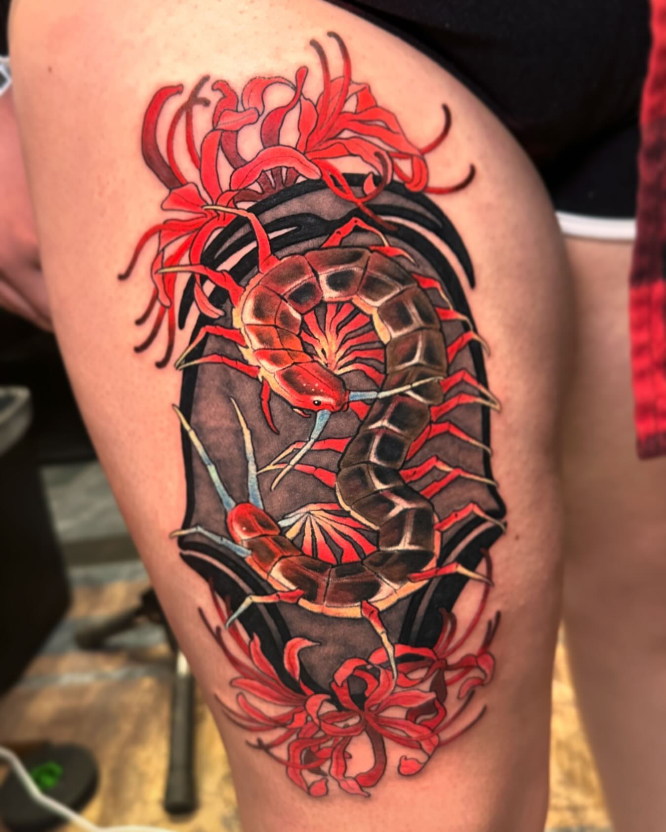 Snake and peony japanese irezumi tattoo on the thigh by Claire Evans, San Francisco, California