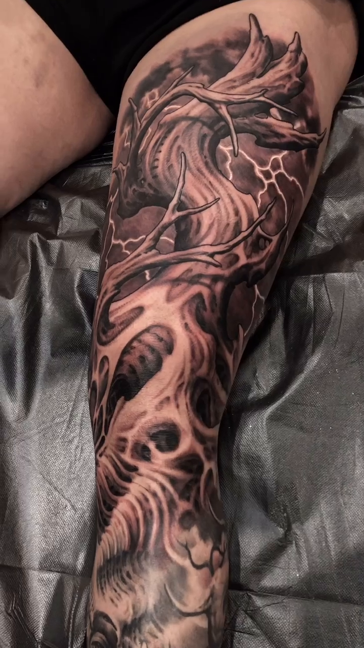 Biomechanical creature dark realism tattoo by Oak Adams