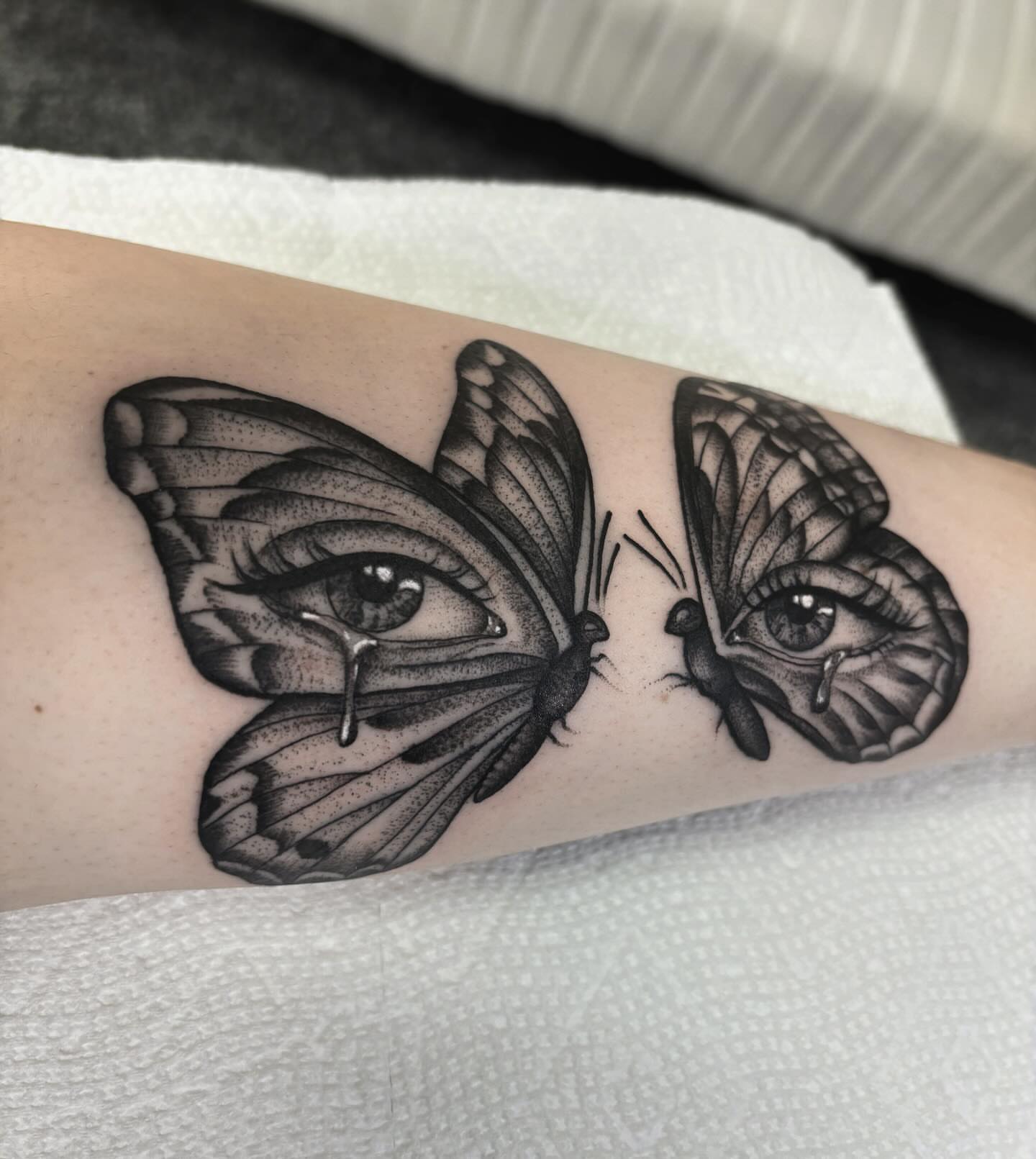 Eyes and butterflies dotwork tattoo on the forearm by 𝐀𝐘𝐀𝐍𝐀𝐇