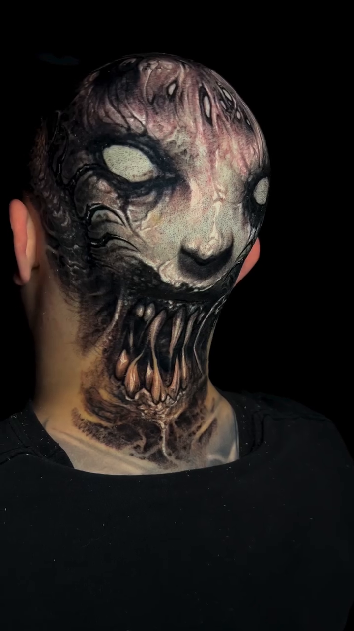 Demonic face dark realism tattoo by Brandon Herrera