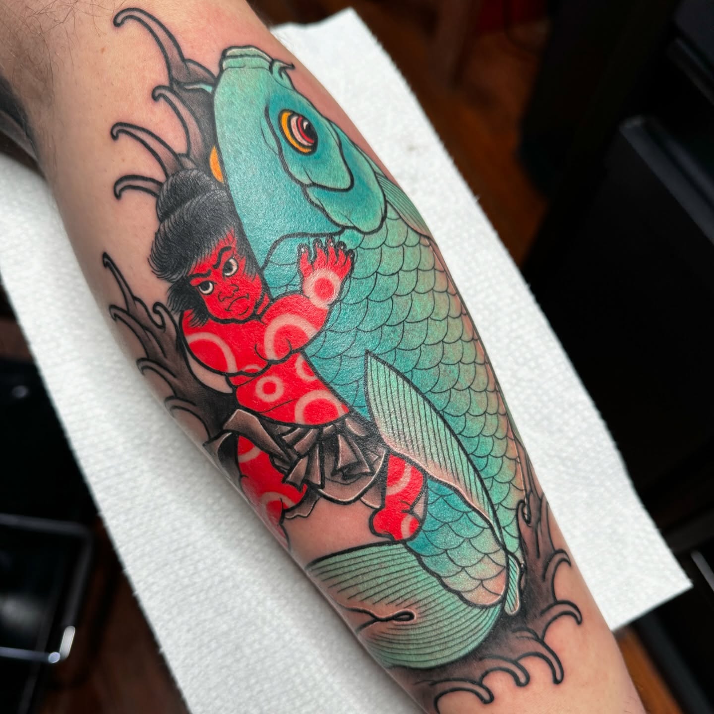 Koi fish and samurai japanese irezumi tattoo on the forearm by kenneth nash