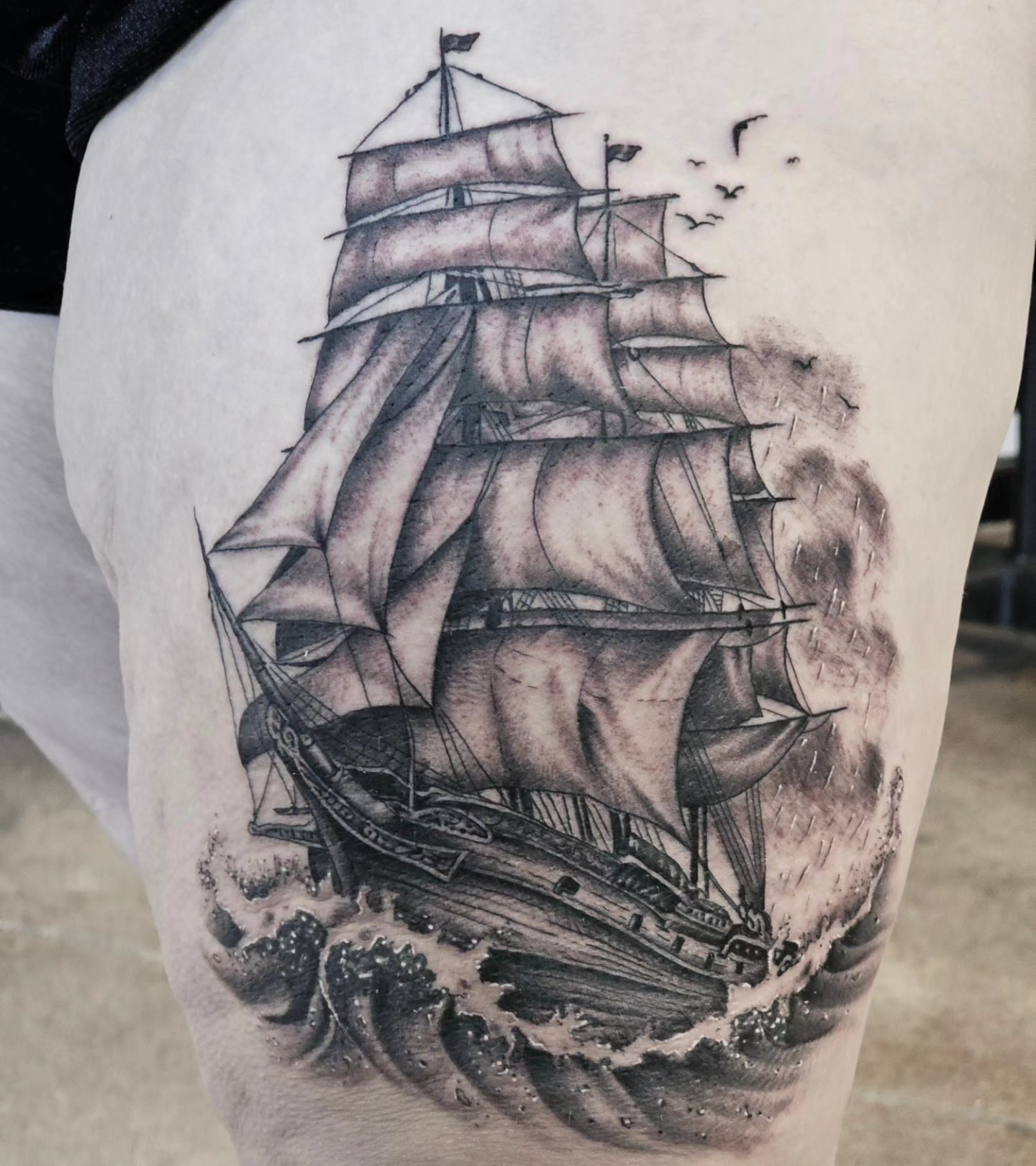 Sailboat realism tattoo on the thigh by BZ Artistry