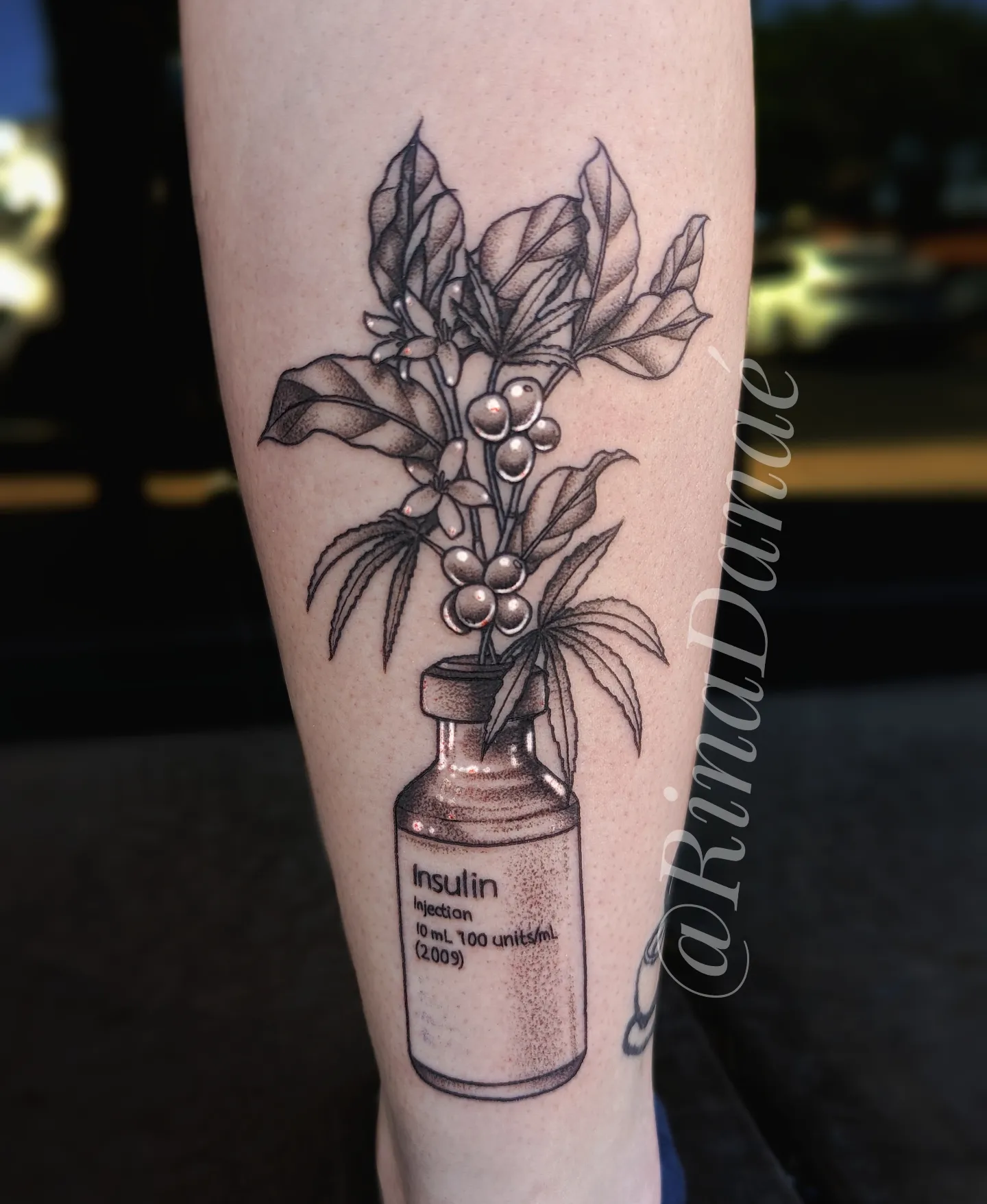 Coffee plant in insulin bottle realism tattoo on the forearm by Rina Danaé Tattoo🌿