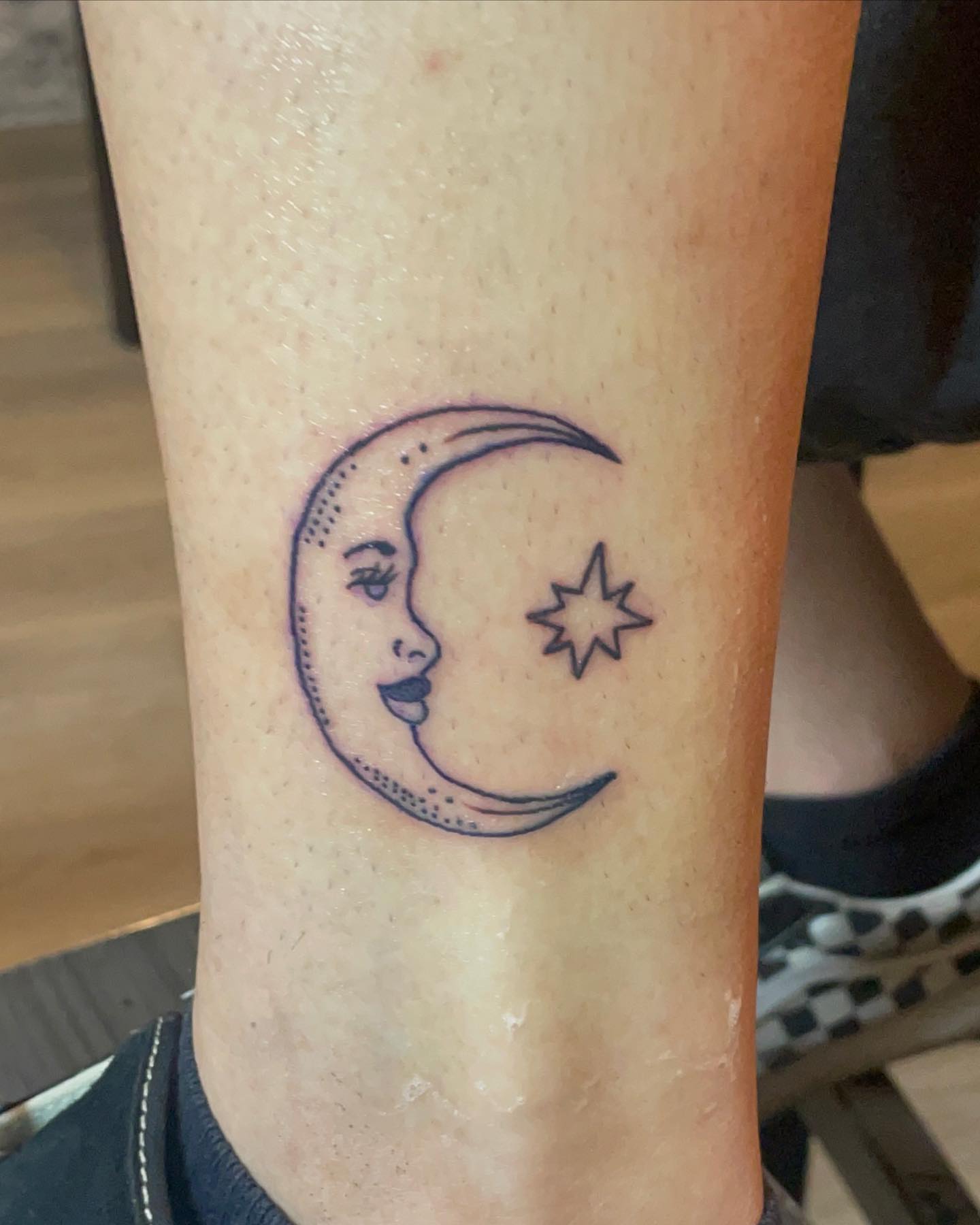 Moon and star dotwork tattoo on the forearm by ART