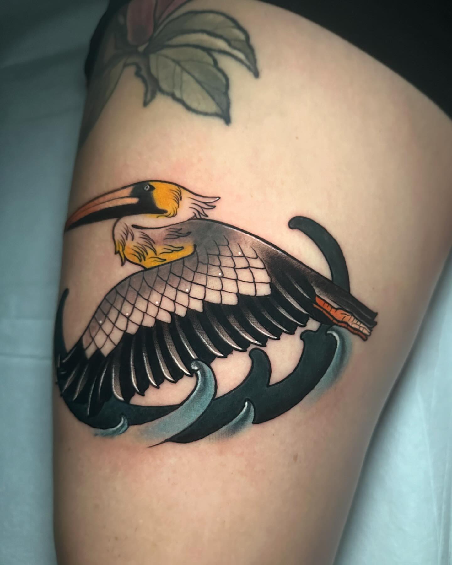 Toucan American traditional tattoo on the thigh by Lexi Wilkinson