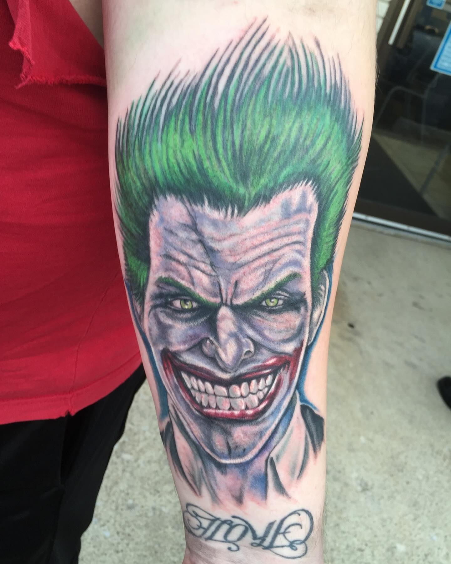 Joker realism tattoo on the forearm by KJ