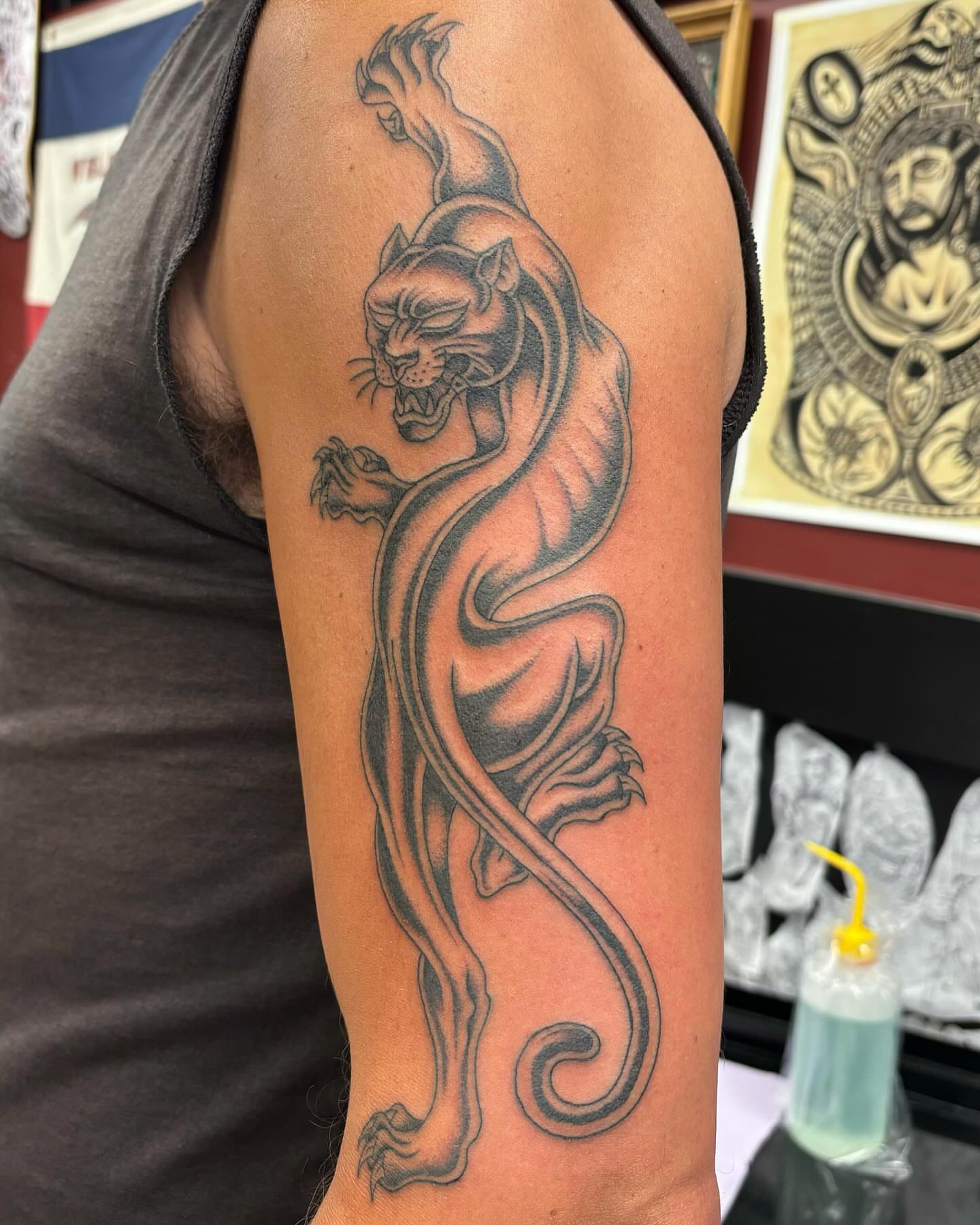 Panther black and grey tattoo on the forearm by Brayden P Tattoo