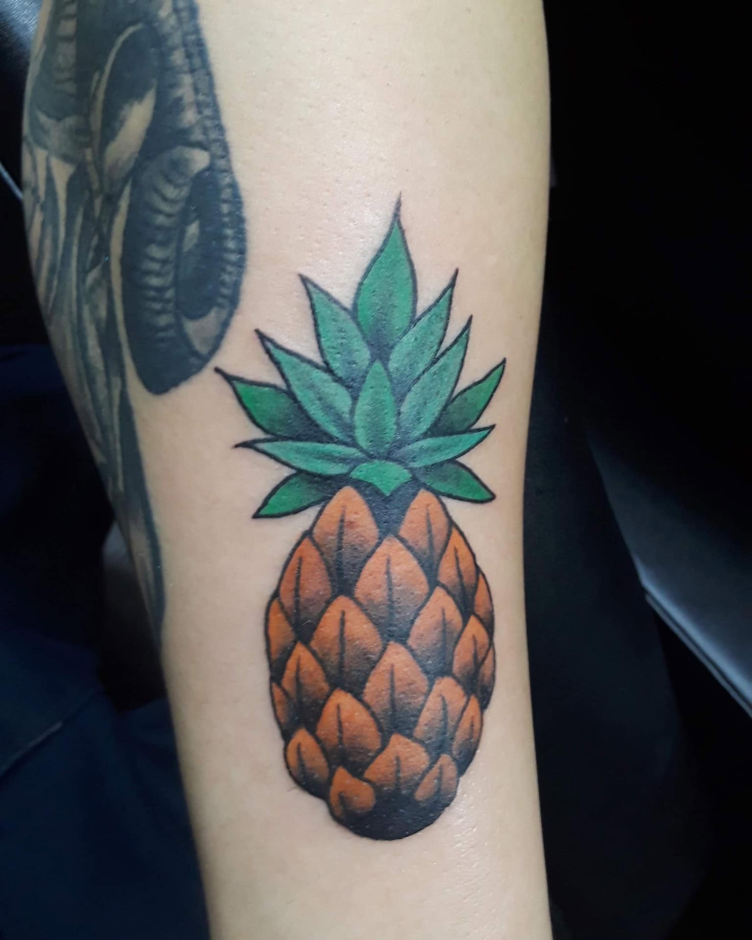 Pineapple realism tattoo on the forearm by Gabriel Lawton