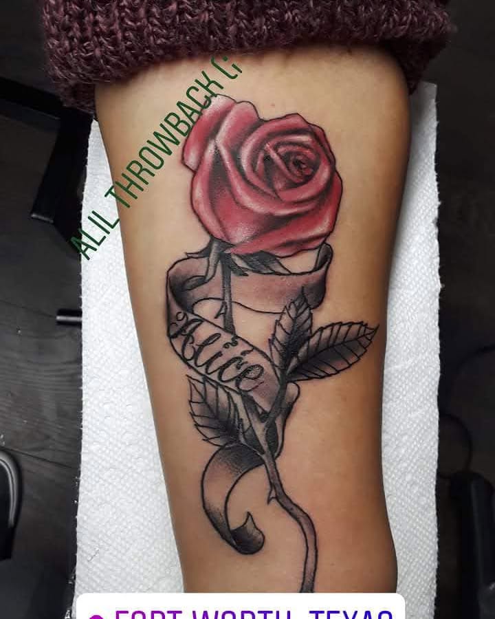 Red rose realism tattoo on the forearm by Gabriel Lawton