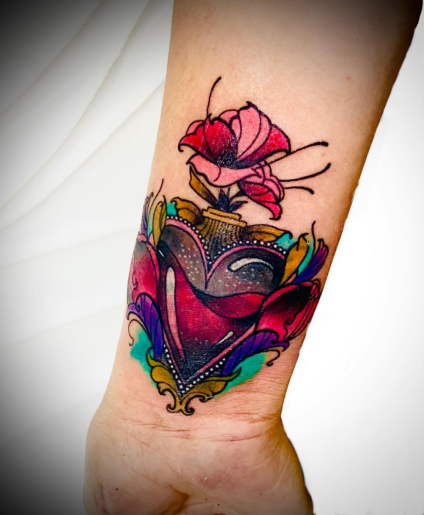 Rose and perfume bottle American traditional tattoo on the forearm by Aldocasales@tatto