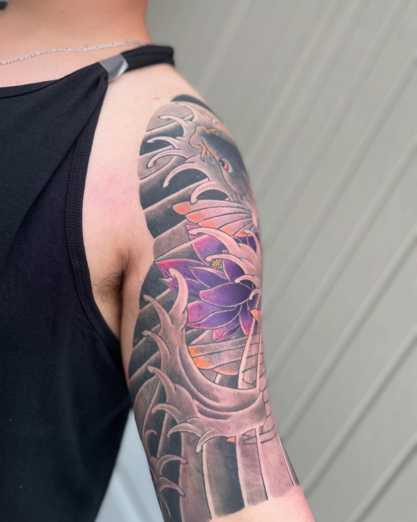 Lotus flower japanese irezumi tattoo on the upper arm by Ei Horimiya Omiya