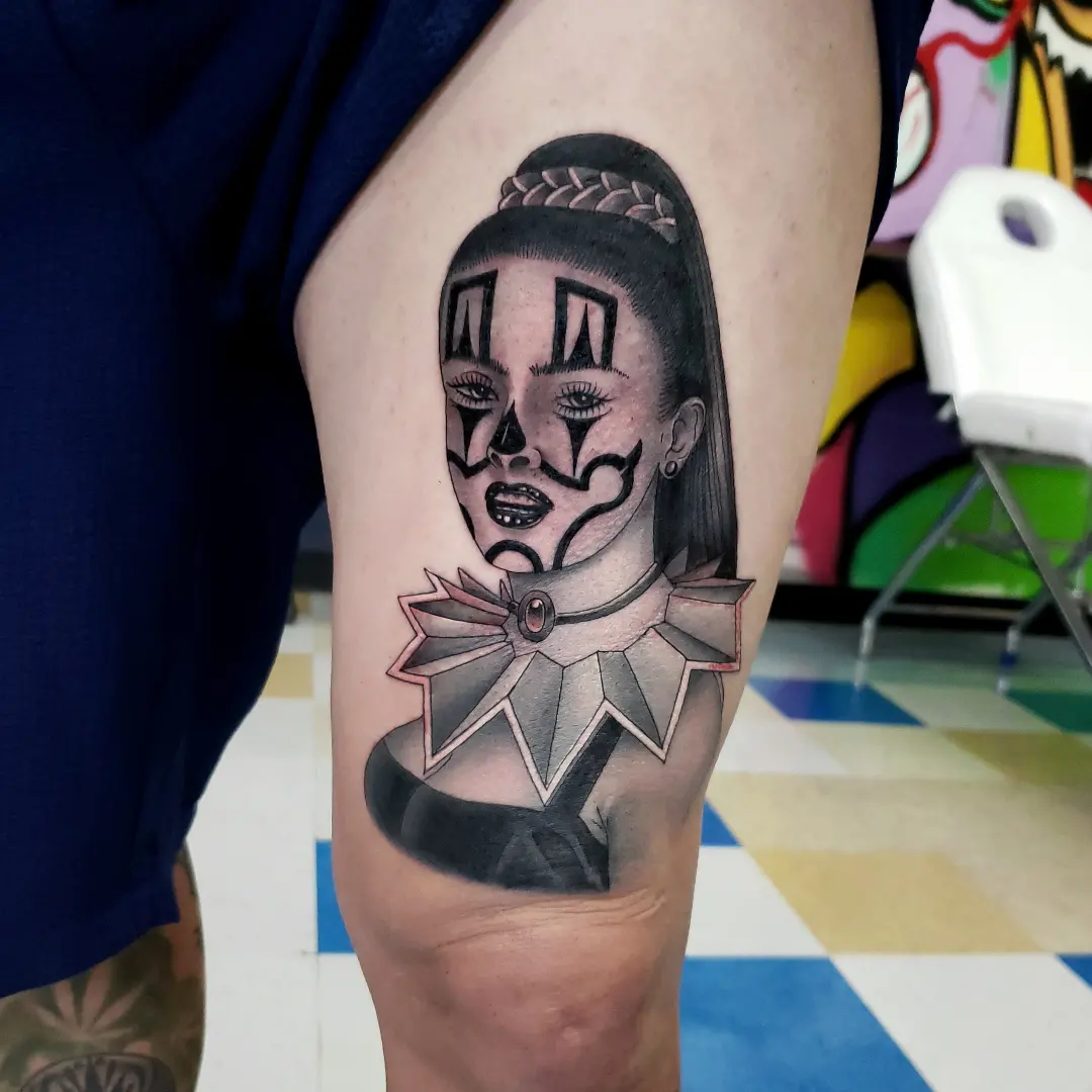 Clown black and grey tattoo on the forearm by Jake Lee