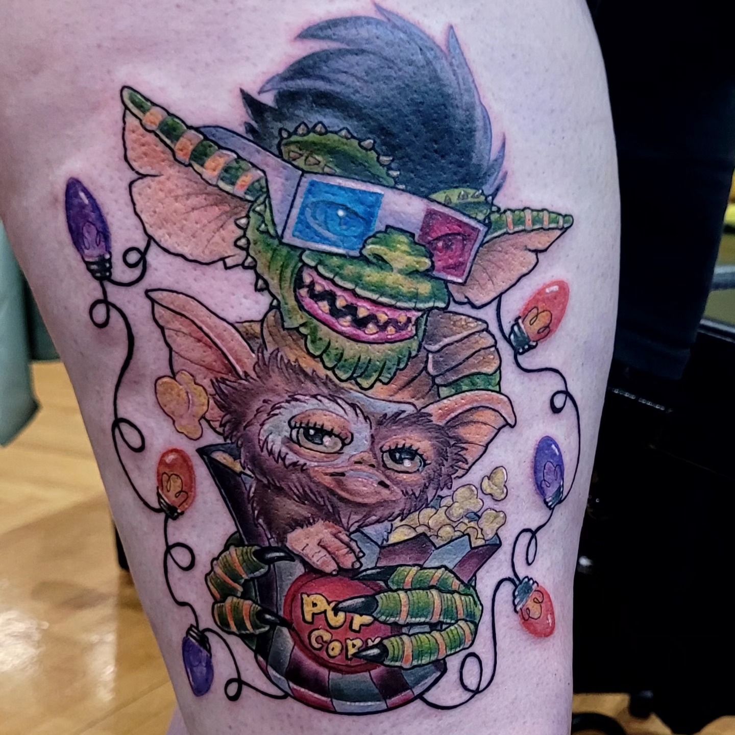 Gremlin new school tattoo on the thigh by Dawne Michele