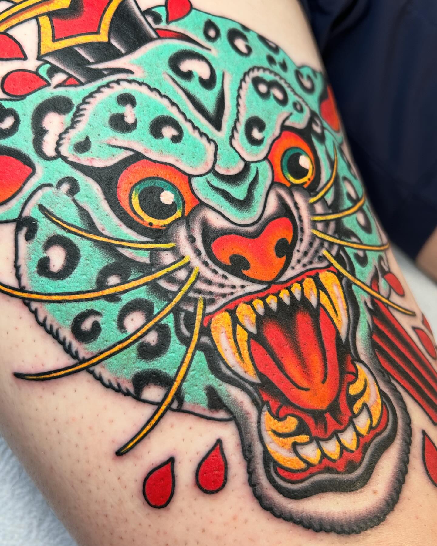 Jaguar American traditional tattoo on the thigh by Adam Mir