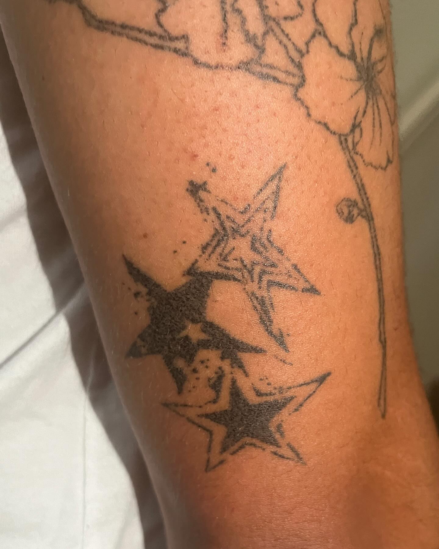 Stars dotwork tattoo on the forearm by hana