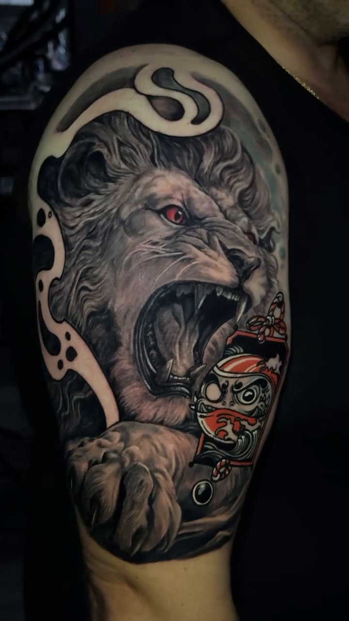 Lion with ornate object realism tattoo by Adrian Gonzalez