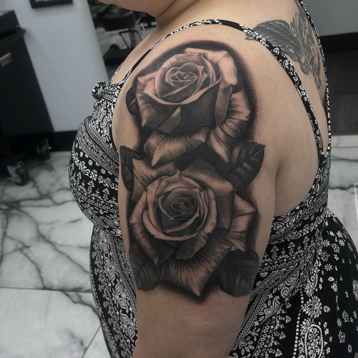 Roses realism tattoo on the shoulder by Austin Jones