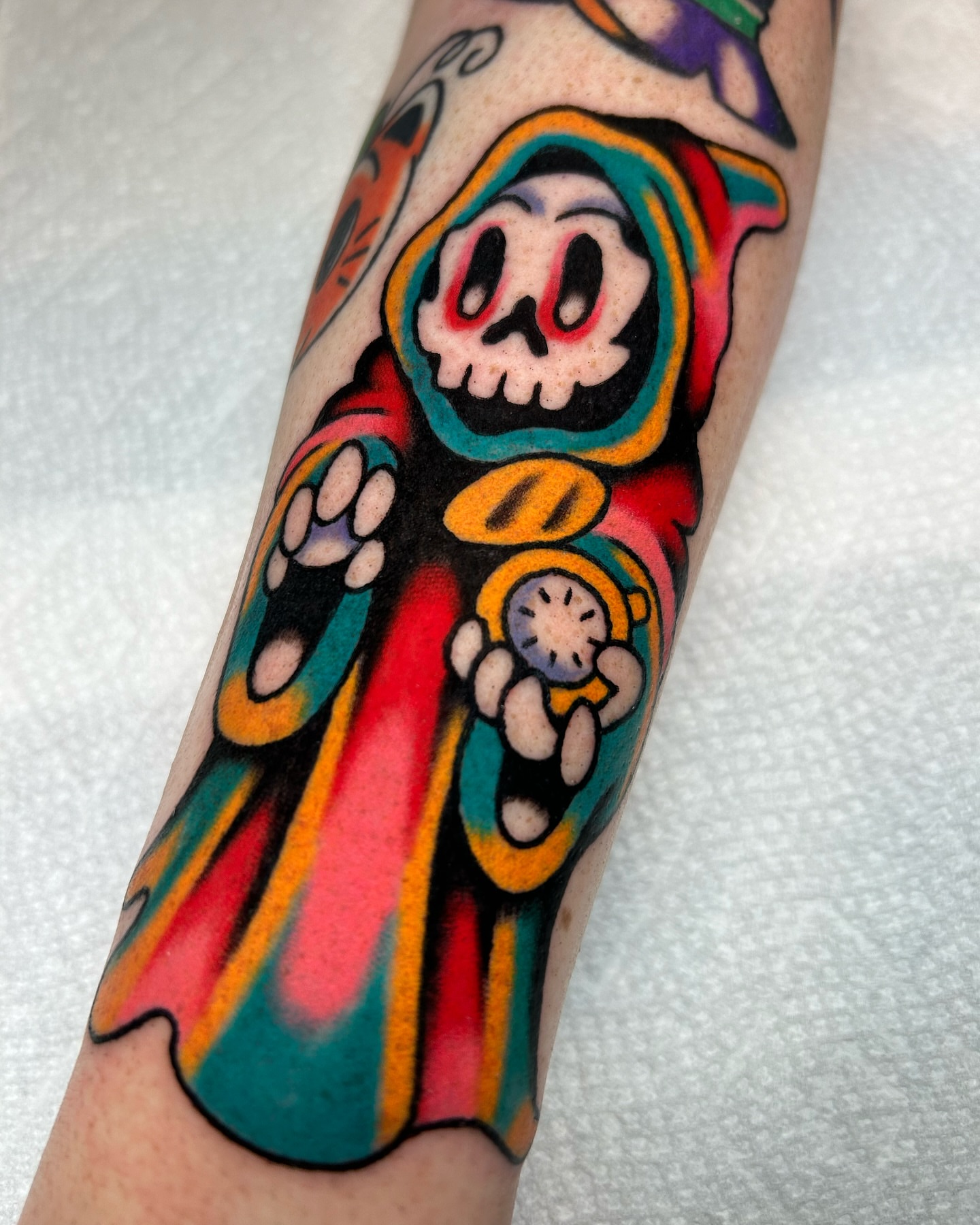 Skull new school tattoo on the forearm by Mitch Hoggard