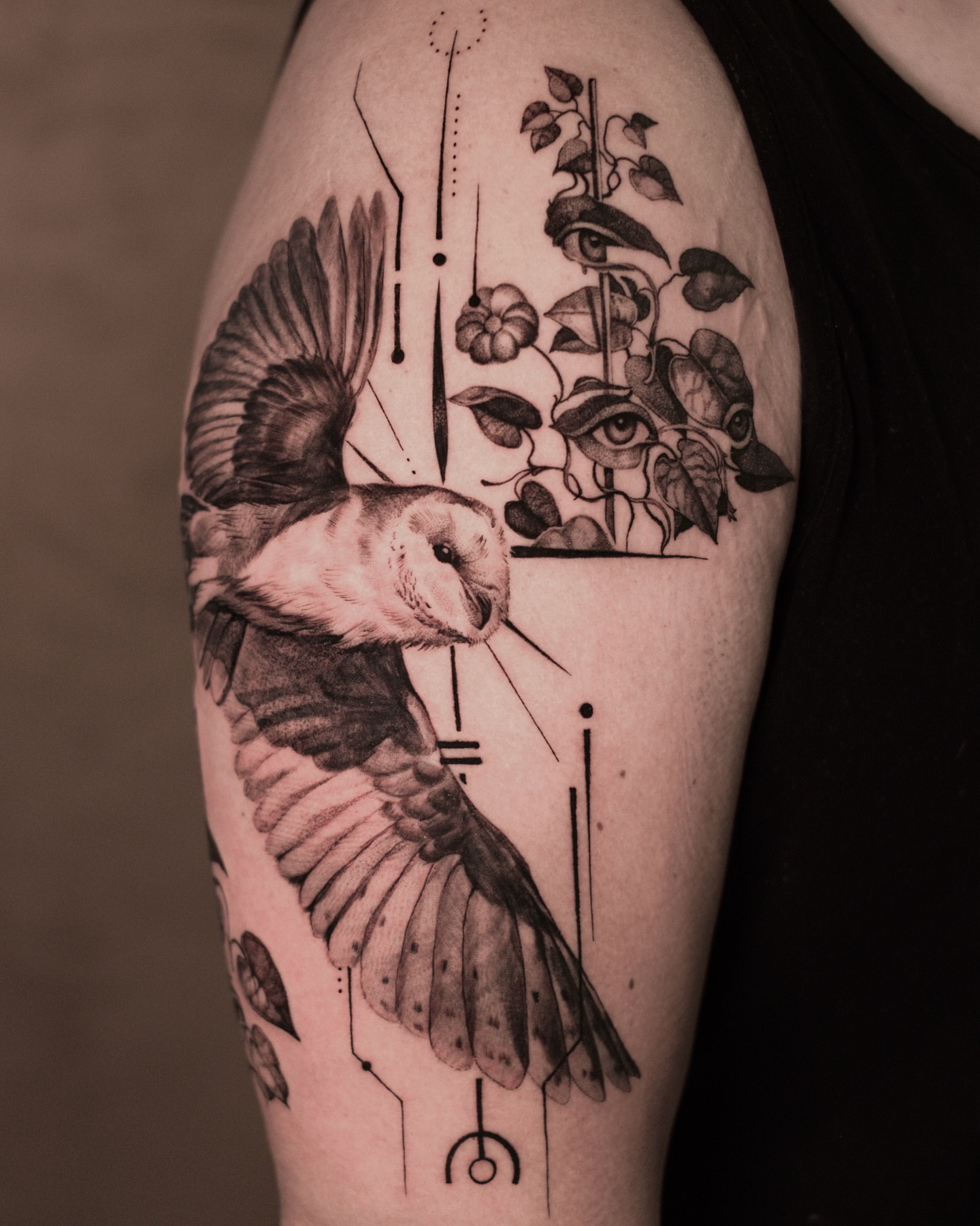 Bird and floral realism tattoo on the shoulder by Anna Chernova, San Francisco, California