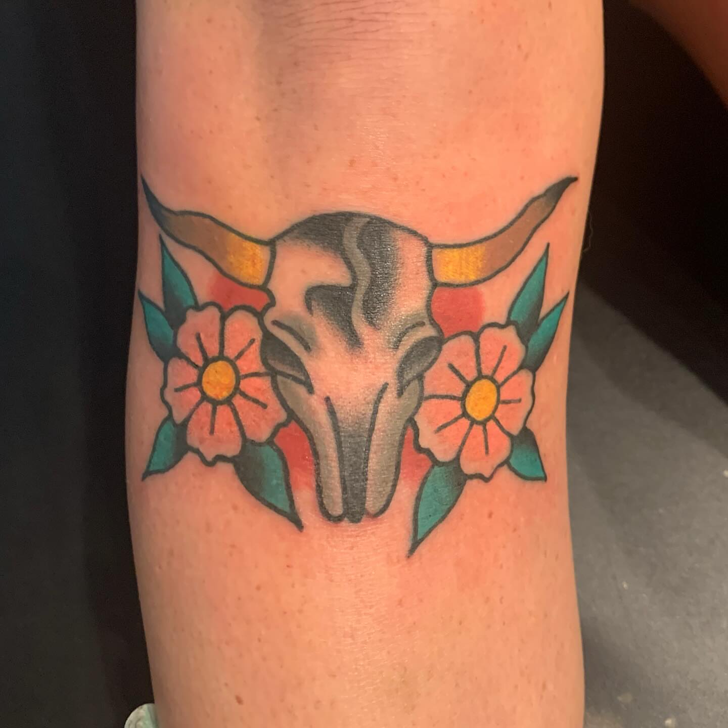 Bull skull with flowers American traditional tattoo on the forearm by mike_howard