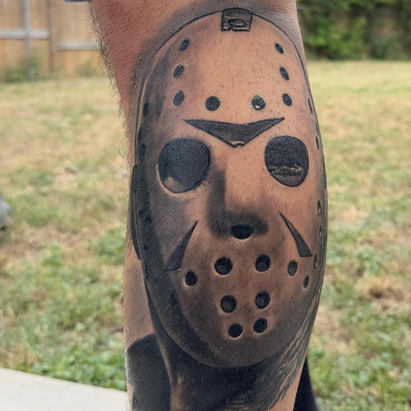 Jason voorhees mask black and grey tattoo on the forearm by Rey Olivares