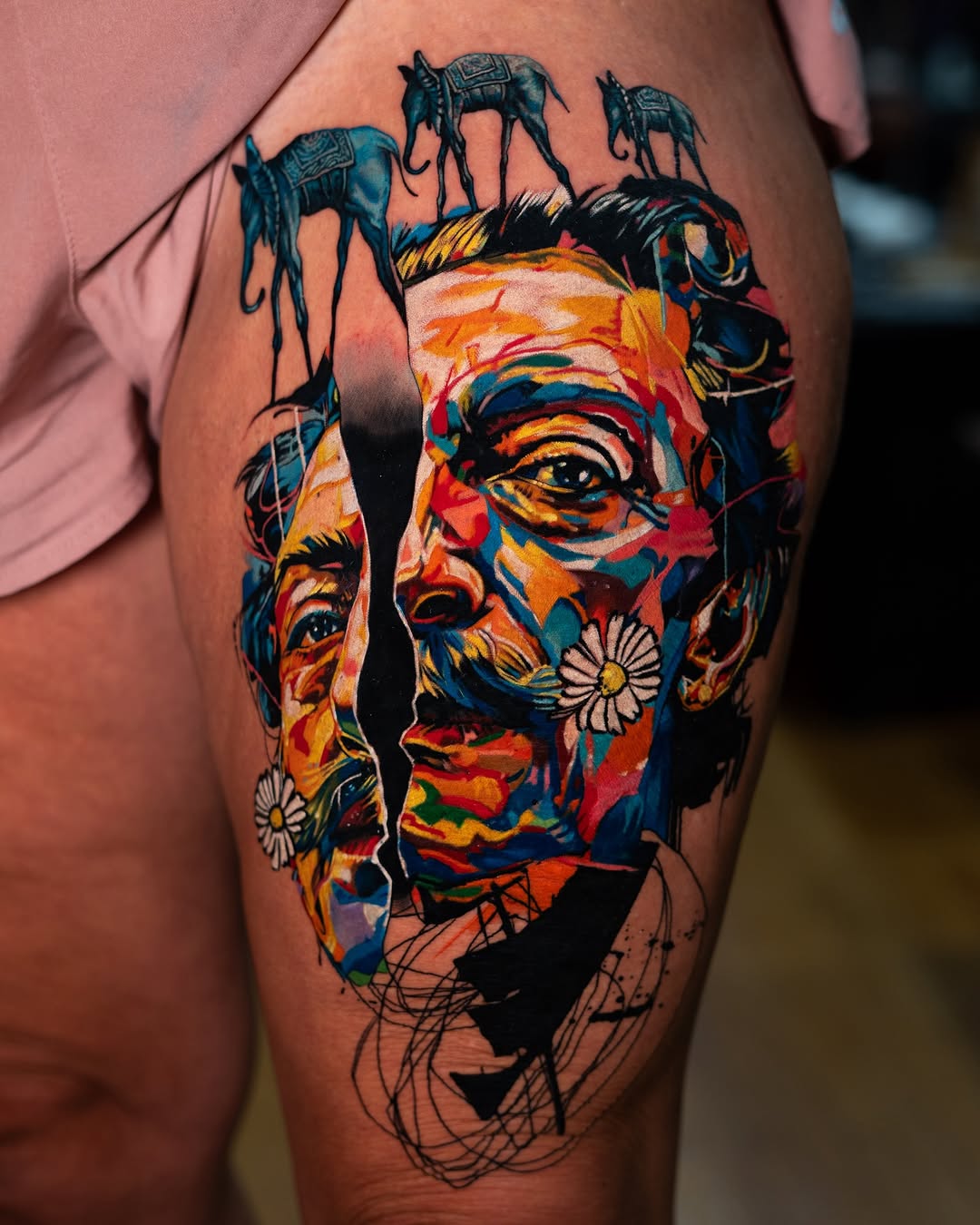 Salvador Dali portrait with elephants surrealism tattoo on the thigh by Israel De Jesus Legonier Aguliera
