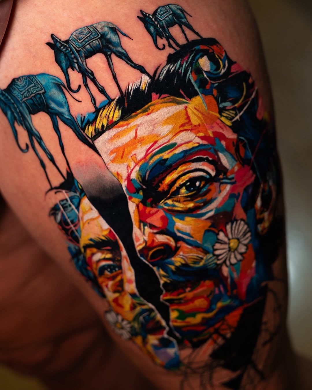 Surreal portrait with elephants surrealism tattoo on the thigh by Israel De Jesus Legonier Aguliera