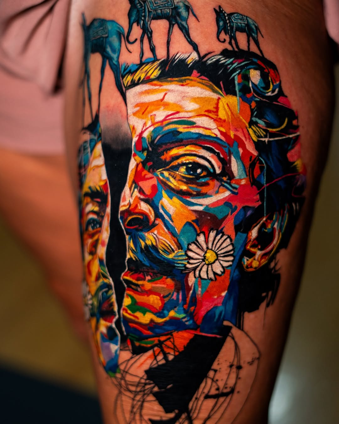 Surrealist portrait with elephants surrealism tattoo on the thigh by Israel De Jesus Legonier Aguliera
